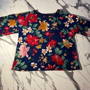 This is a kids XL floral blouse by Old Navy.